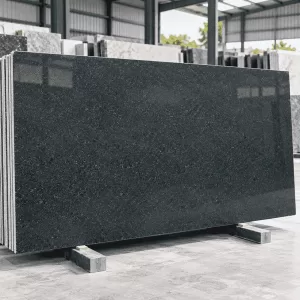 Rajyog Green Granite polished slab displayed in a stone warehouse