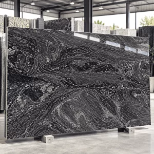 Classic Paradiso Granite polished slab with dark grey and brown wavy patterns in a stone showroom